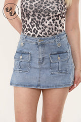 Front view of blue stretchy mid-rise cargo denim skorts with front utility pockets