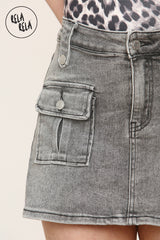 Close-up of functional cargo pocket on grey stretchy denim skorts
