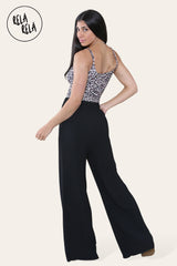 Back view of black plissé wide leg trousers – adjustable drawstring waist on trousers with pleats.