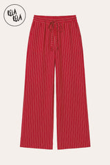 Flat lay of RELA RELA Red pinstripe trousers, showing the deep tonal pinstripe weave on rich crimson ground, elastic waistband and relaxed wide-leg silhouette on a clean white background.
