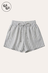 Flat lay of the Rela Rela White vertical striped flowy loungewear shorts with elastic waistband and two side pockets, showcasing the breathable faux linen texture and timeless stripe design.