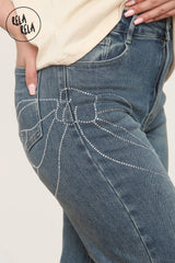 Viral Stretchy Relaxed Mid-Waist Rhinestone Bow Detail Jeans in Denim Blue