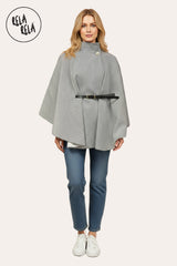 Model wearing charcoal belted high neck poncho cape jacket paired with autumn outfit.