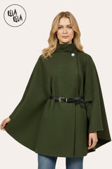Front view of khaki belted poncho cape jacket with high neck and button closure.