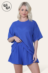 Model wearing royal blue shorts co ord set – crochet texture two piece outfit