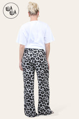 Back view of white leopard print wide leg trousers