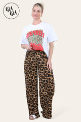 Model styling brown leopard print pleated trousers with tee shirt