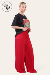 Side view of elasticated wide leg trousers in bold red