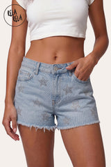 Front view of model wearing RELA RELA Silver Star Diamante Stretchy Denim Shorts, featuring button closure, front pockets, scattered star diamante embellishments, and raw distressed hem.