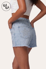 RELA RELA Silver Star Diamante Stretchy Denim Shorts - 3/4 Back-Side Angle on Model, showcasing back pocket star detailing and distressed hem.