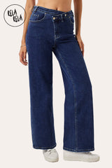 Side view showing the relaxed dad fit and wide leg silhouette of the indigo blue stretchy mid-waist jeans.