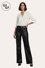 Model wearing black faux leather dad fit wide leg trousers – versatile styling modern outfits.
