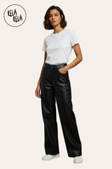 Model wearing chocolate faux leather dad fit wide leg trousers – versatile styling casual street outfits