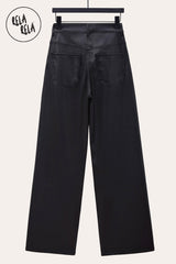 Back view of black wide leg faux leather trousers – stylish dad fit trousers with smooth finish.