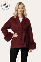 Front view of model wearing Faux Fur Cuff Wrap Coat with Waist Tie Belt in Burgundy