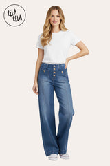 Model wearing in Stretchy Wide Leg Seamed Jeans with buttons in Indigo Wash, styled with a casual top and sneakers.