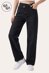 Front model view of RELA RELA Black asymmetric cross-front high-waist wide-leg jeans, showing the sculpted waistband, soft stretch denim and full-length leg.