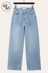 Flat lay of the Blue asymmetric waist wide leg jeans against a neutral background, highlighting the unique cross-front waistband, classic indigo wash, and relaxed wide-leg silhouette.