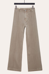 Front View of Taupe pintuck flare jeans with front seam laid flat, showcasing seamed wide leg jeans design.