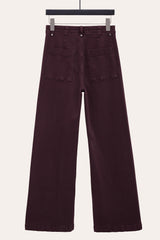 Back view of seam wide leg jeans, highlighting relaxed flared silhouette.