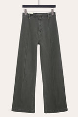 Khaki pintuck flare jeans with front seam laid flat, showcasing seamed wide leg jeans design.