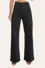 Model wearing front seam flare jeans in black with a fitted top.