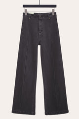 flat lay of front seam flare jeans in dark grey denim – detailed pintuck stitching adds structure and polish.