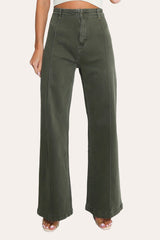 Model wearing front seam flare jeans in khaki with a fitted top