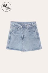 Flat lay front view of the Light Blue stretchy cross-front denim skort on a white background, showcasing the crossover waistband with two adjustable buttons, symmetric front pockets, and the mini-length hemline.