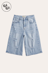 Flat lay of the Light Blue distressed denim jorts, highlighting the strategic rips, raw hems, and authentic vintage-inspired wash.