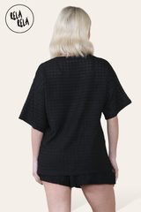 Back view of black knitted co-ord set with T-shirt and shorts