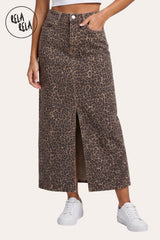 Close front view of RELA RELA Leopard denim maxi skirt showing the split hem, pocket detail and stretch pencil fit.