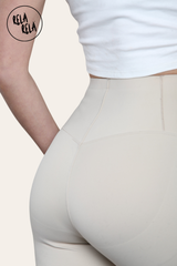 Detail shot of seamless stitching on beige high waisted bum shaping leggings