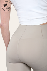 Detail shot of seamless stitching on grey high waisted bum shaping leggings