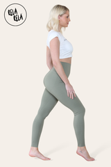 Side profile of bum shaping leggings in olive green