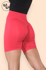 Side angle of red high waisted cycling gym shorts with snug fit